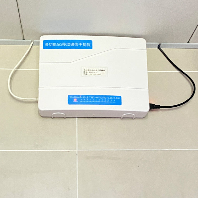 cell phone service blocker with blue labels on the wall