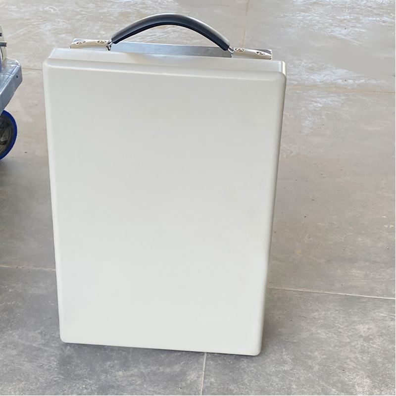 wireless network jammer with black handle on a tiled floor.